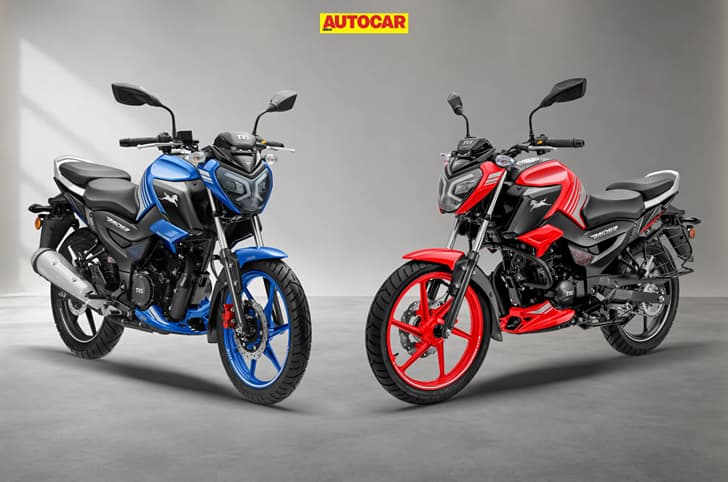 TVS Raider TFT DD in Blue and SXC DD in Red colour, front right quarter and front left quarter respectively.