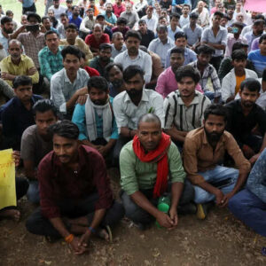 Factory workers hold a protest demanding wage hikes from their company