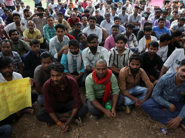 Factory workers hold a protest demanding wage hikes from their company