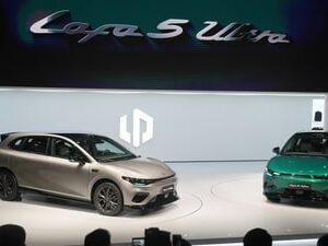 Attendees look at the Leapmotor new Lafa 5 Ultra models on stage after being unveiled by Leapmotor President Cao Li at the Auto China 2026, in Beijing, Friday, April 24, 2026. (AP)