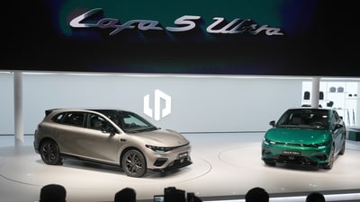 Attendees look at the Leapmotor new Lafa 5 Ultra models on stage after being unveiled by Leapmotor President Cao Li at the Auto China 2026, in Beijing, Friday, April 24, 2026. (AP)