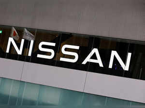 Japan’s national flag is reflected on a logo of  Nissan Motor Co. at its headquarters in Yokohama