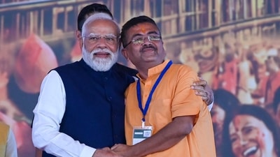 Prime Minister Narendra Modi warmly hugged chief minister of West Bengal Suvendu Adhikari after swearing-in ceremony at Brigade Parade Ground in Kolkata, India, on Saturday, May 9, 2026. (Samir Jana/ Hindustan Times)