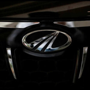 The logo of Mahindra and Mahindra is seen on a car at a showroom in Mumbai