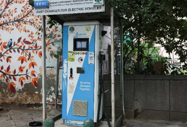 An electric car charging station is seen at a market in New Delhi