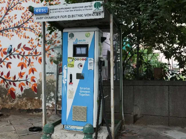 An electric car charging station is seen at a market in New Delhi