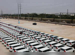 Maruti Suzuki Ertiga cars are parked beside an in-plant railway siding at Maruti Suzuki's plant in Manesar, Haryana